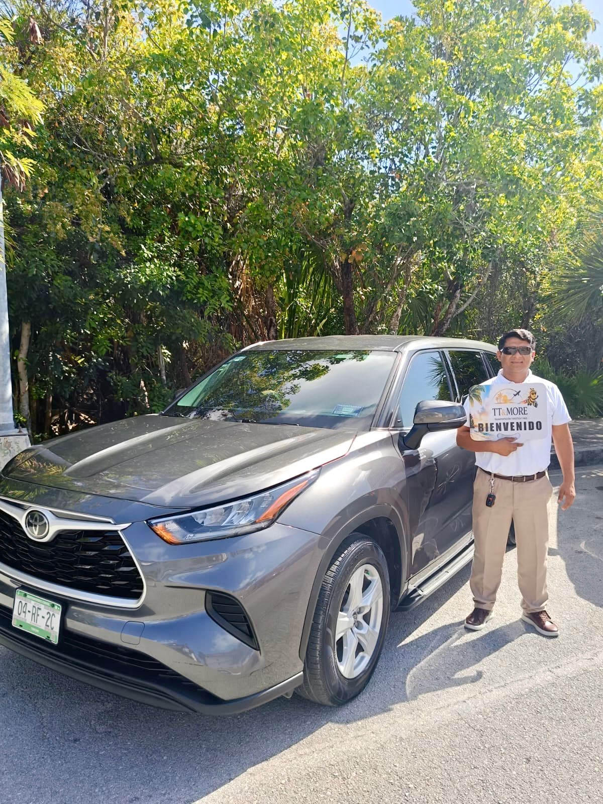 TT & More driver beside a gray Toyota private vehicle