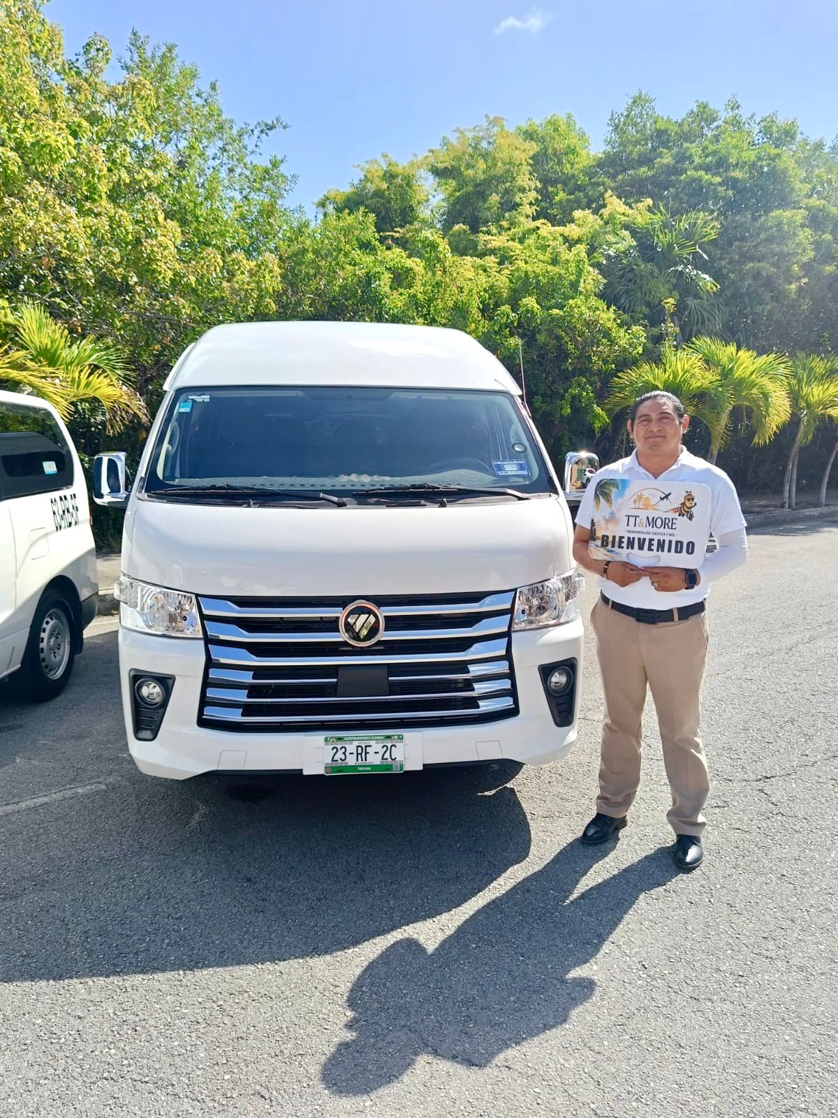 TT & More driver beside a white van
