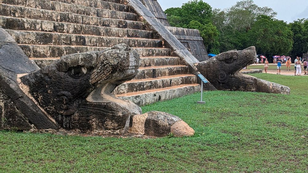 Feathered-serpent heads at the foot of El Castillo, Chichén Itzá