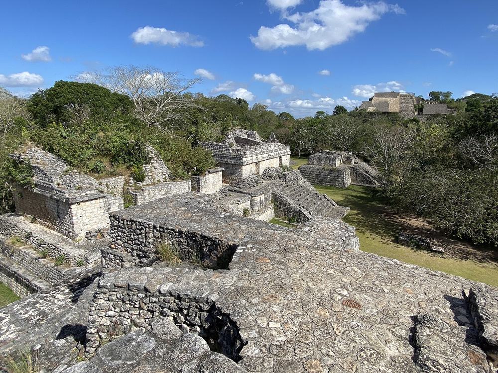 Ruined stone buildings around the main plaza of Ek Balam