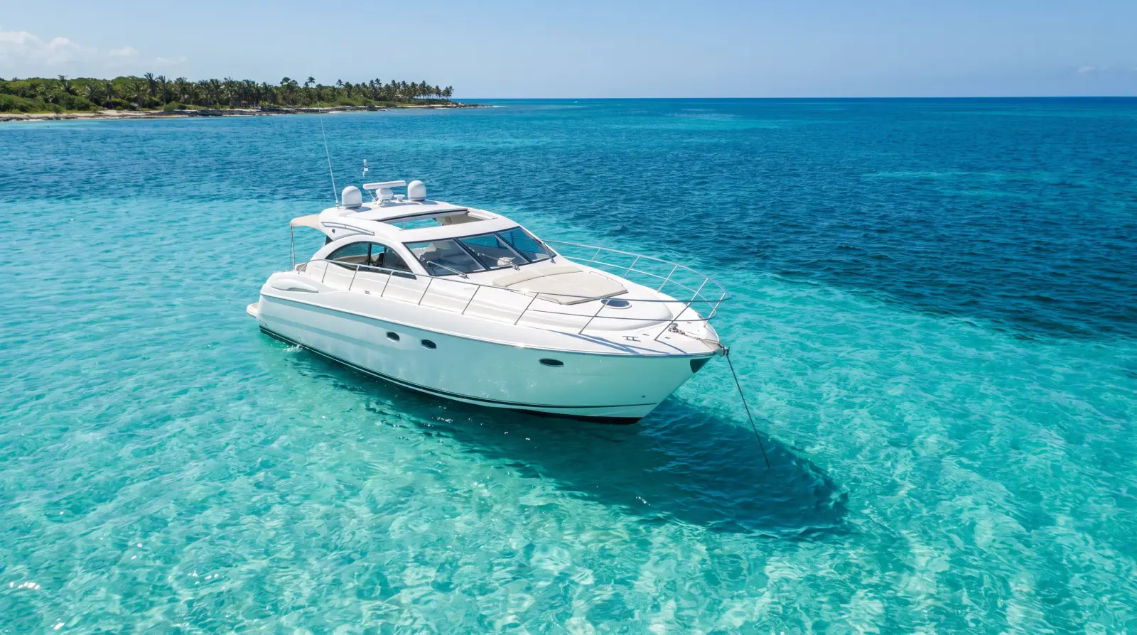 Private yacht anchored in clear turquoise water off Cancún